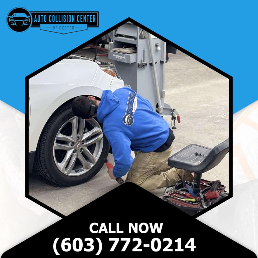 What to Do When Someone Hits Your Parked Car and Drives Off 2 An auto body technician in a blue hoodie kneeling down to repair the wheel well liner and front fender assembly of a white car.