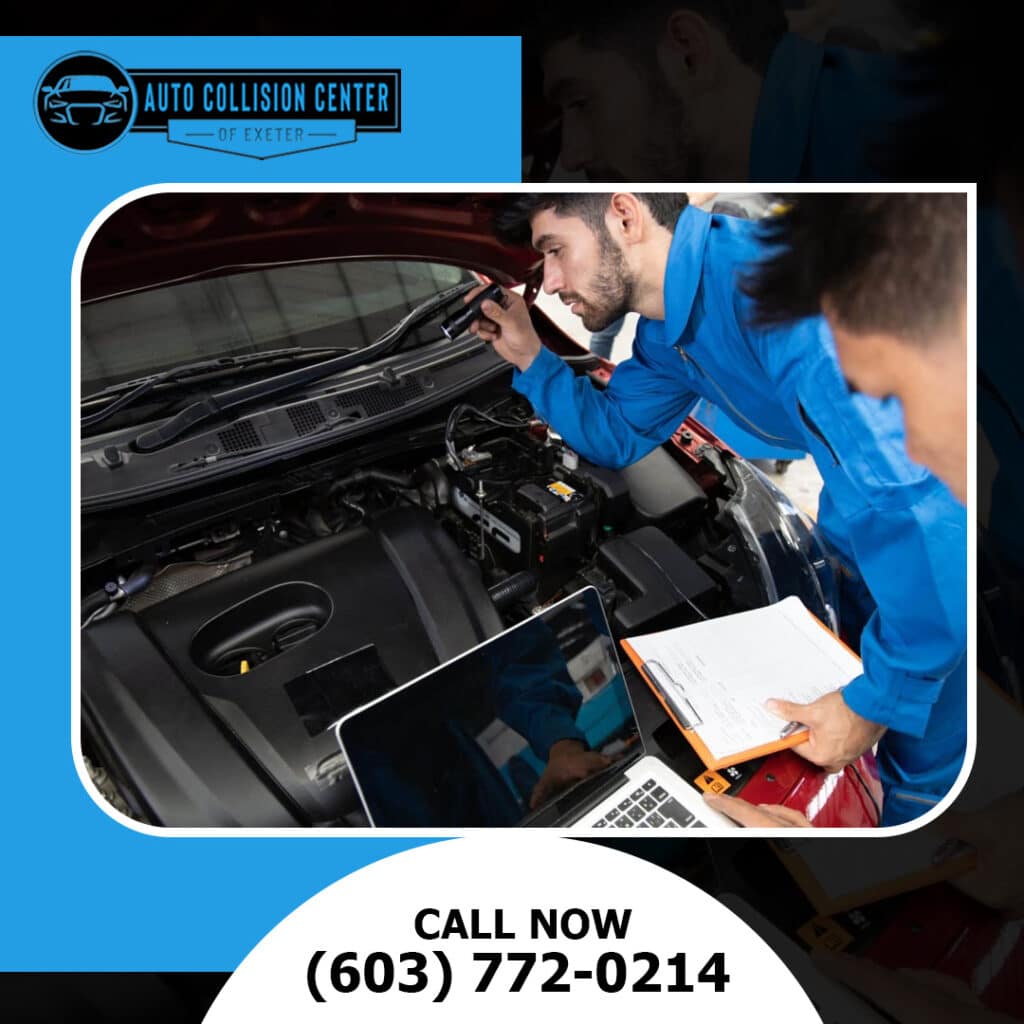Can You Choose Your Own Auto Body Shop After an Accident in New Hampshire? 2 Auto technicians using a flashlight, diagnostic laptop, and inspection checklist to evaluate an open engine bay.